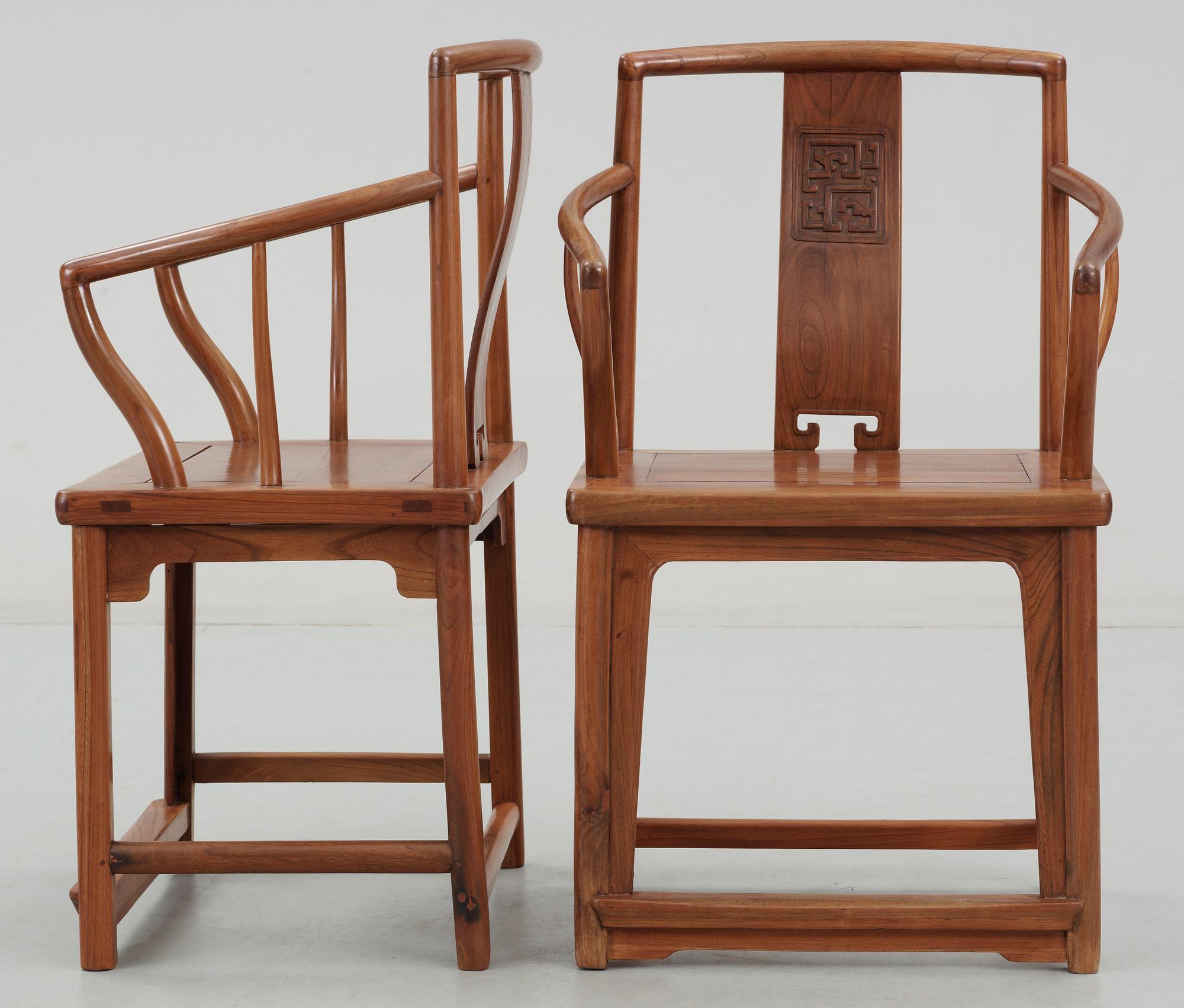 A pair of hardwood armchairs, Qing dynasty.