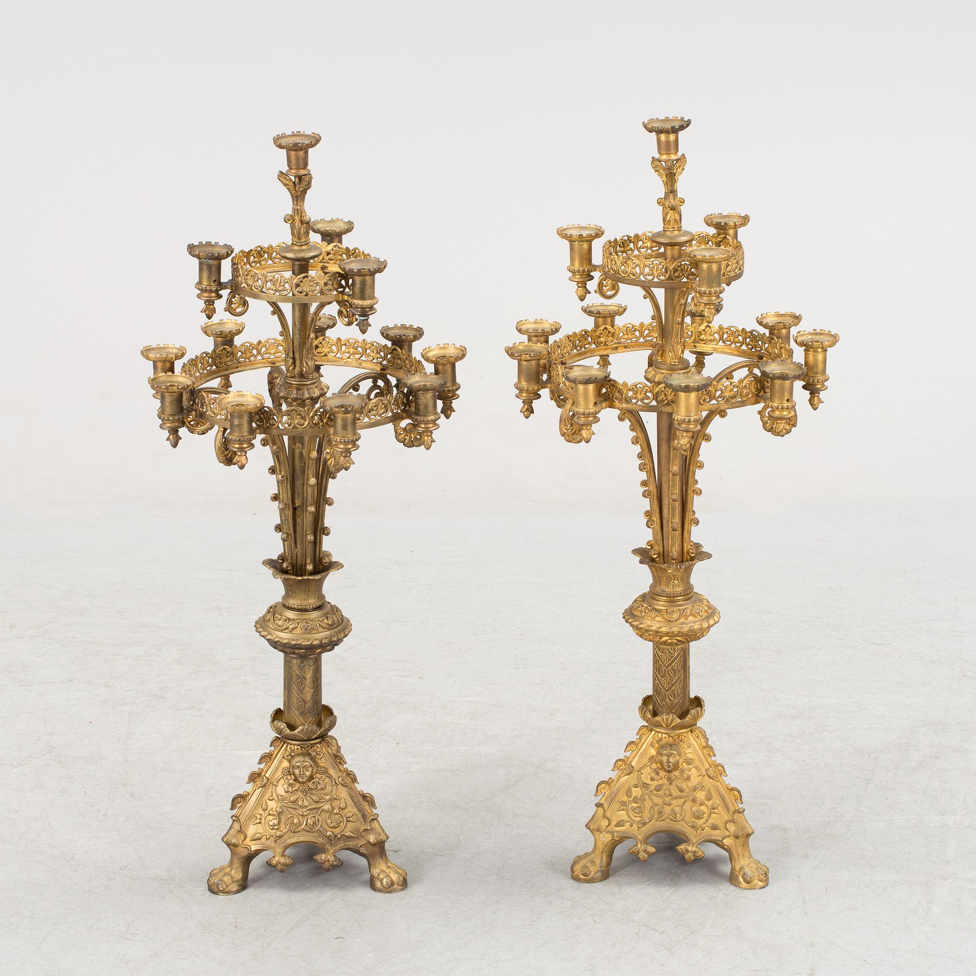 Two similar 19th century bronze candelabras.