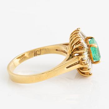 Ring with emerald and baguette-cut diamonds.
