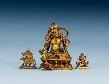 1481. A set of three gilt bronze figures, one of Kuwera and two of Buddha, Qing dynasty, 18th/19th Century.