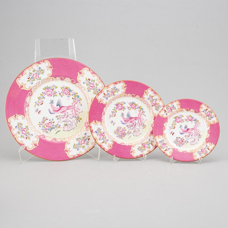 A part 'Pink Cockatrice' dinner and coffee and tea service, England, Minton, early 20th century (123 pieces).