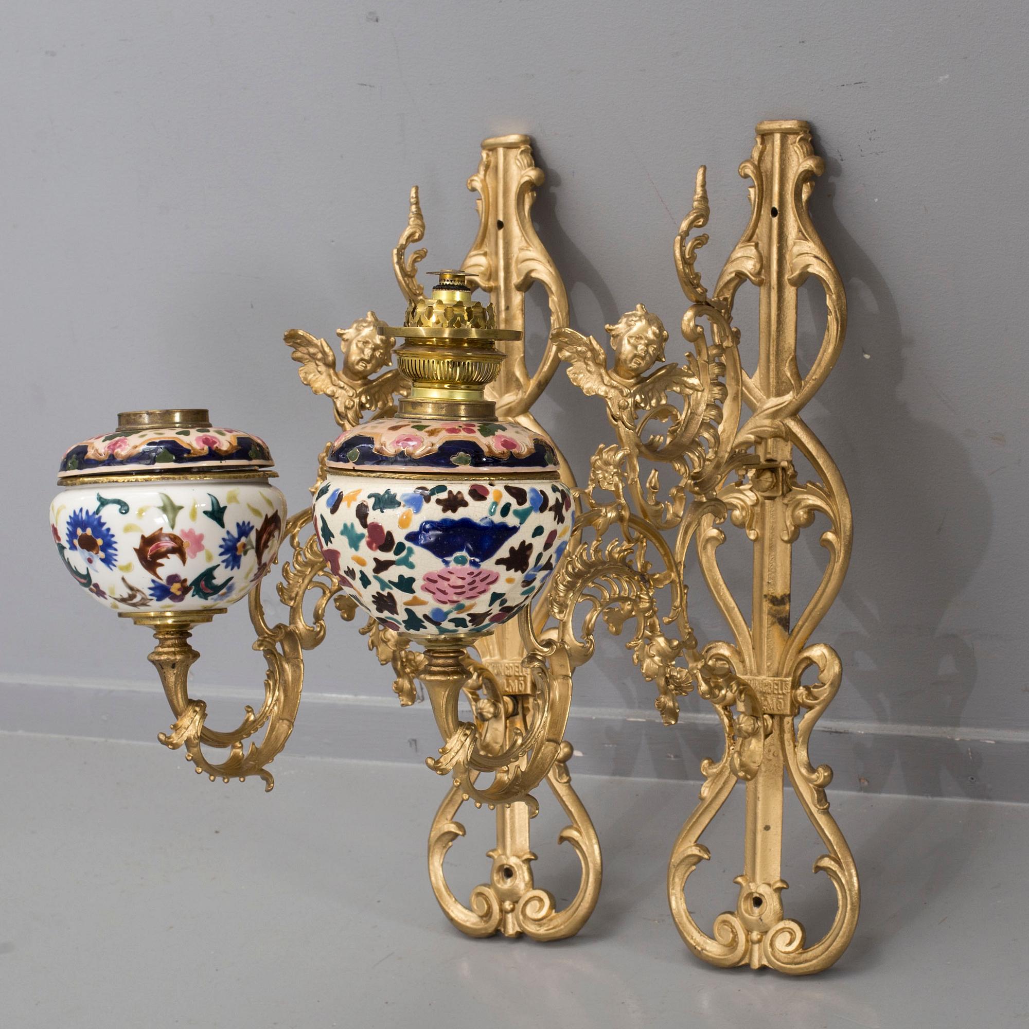 A pair of wall paraffin lamps, turn of the century 1900. Made by Ljungdells Malmö Sweden.