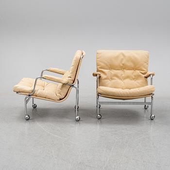 Bruno Mathsson, a pair of easy chairs and a coffee table, 'Karin', Dux, second half of the 20th Century.