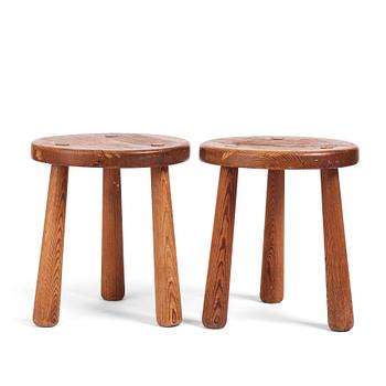 230. Axel Einar Hjorth, a pair of "Skoga" stained pine stools, Nordiska Kompaniet 1930s.