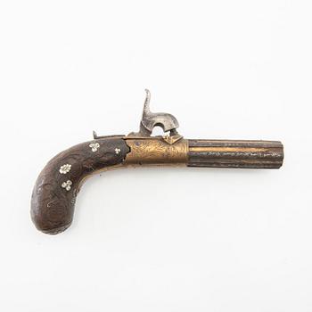 A British percussion pistol, 19th century.
