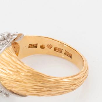 A WA Bolin ring in 18K gold set with round brilliant-cut diamonds.