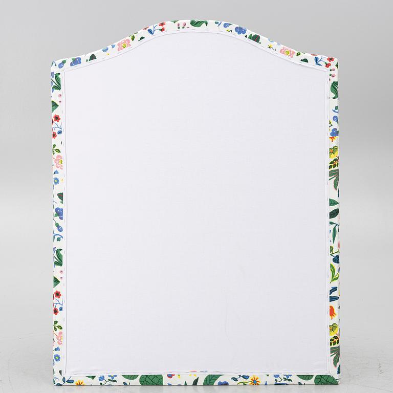 Headboard, upholstered in fabric from Svenskt Tenn.