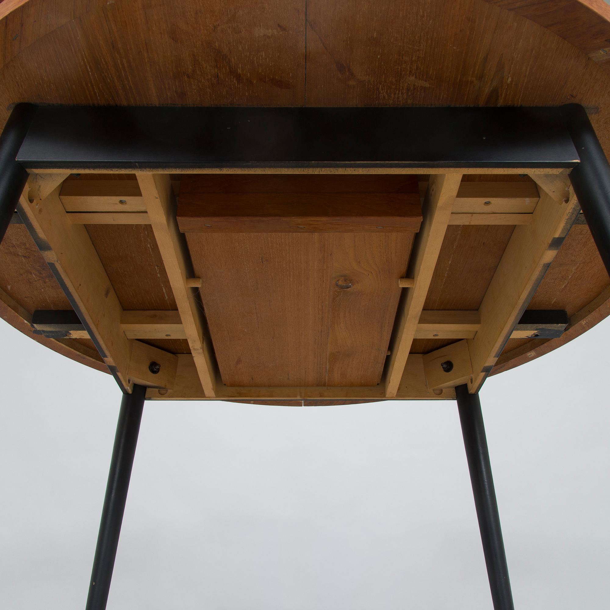 A mid-20th century dining table.