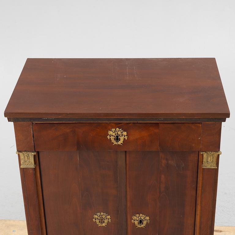 An Empire cabinet, first half of the 20th Century.
