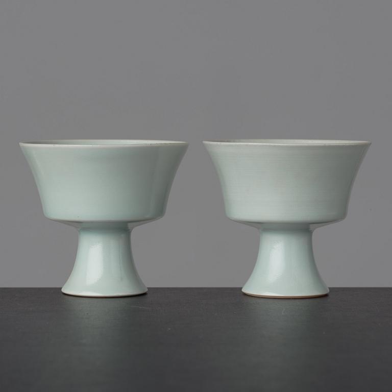 A pair of celadon glazed stemcups, China, 20th Century with Yongzheng mark.