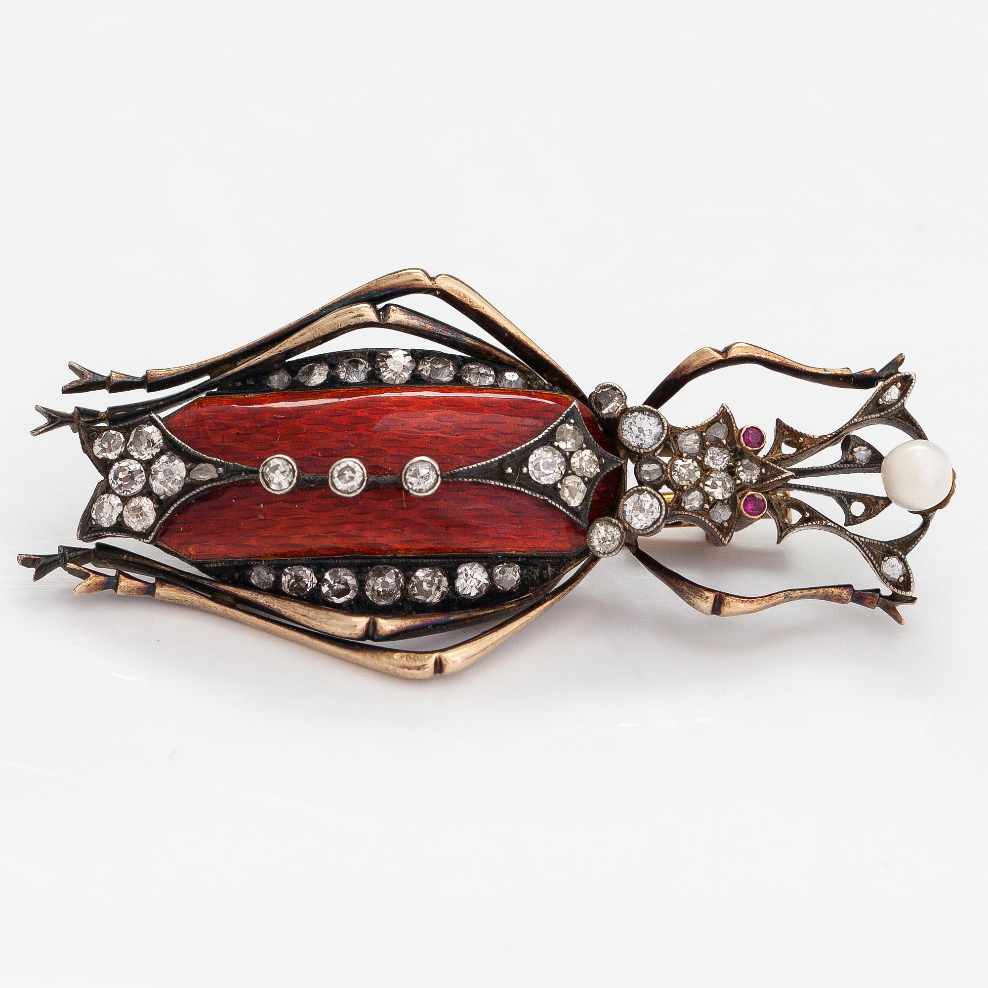A 14K gold brooch with a cultured pearl, enamel, old and rose cut diamonds and rubies. Russia turn of the 20th century.