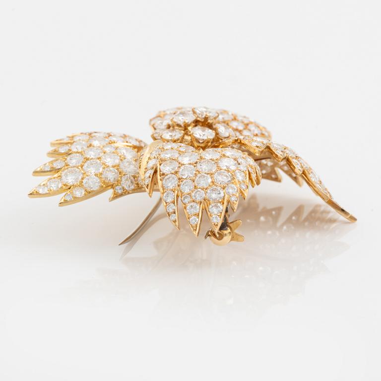 Van Cleef & Arpels brosch 18K guld med runda brilljantslipade diamanter.