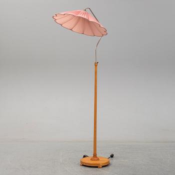 A 1940s birch wood floor lamp.
