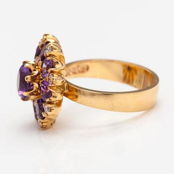 An 18K gold ring with ametysts and diamonds ca. 0.20 ct in total. Ofelia Jewelry, Helsinki 1998.