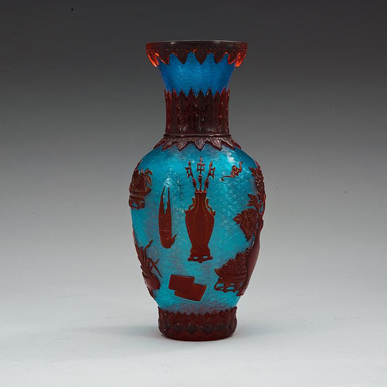 A Chinese red, blue and gold splashed Peking glass vase, 20th Century.
