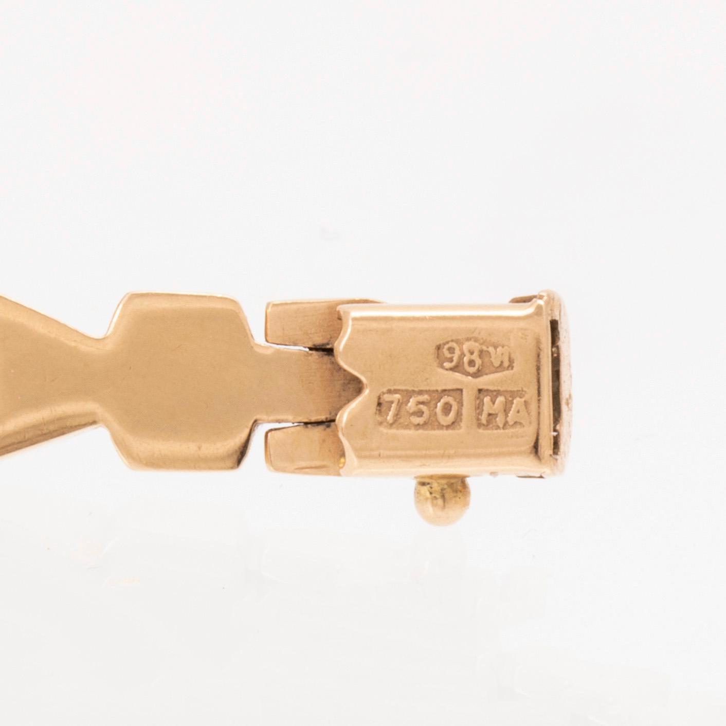 An 18K gold bracelet.