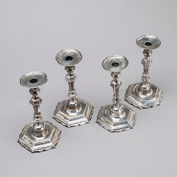 Two simular pairs of candlesticks, two marked Barde, Geneve 18th century, two with later marks.