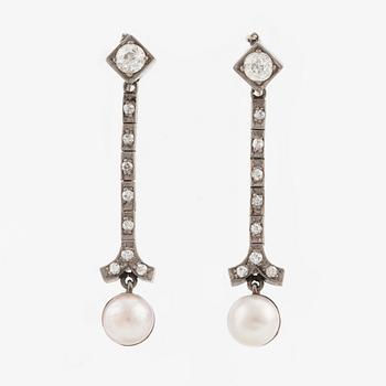 A pair of 18K gold and cultured pearl earrings.