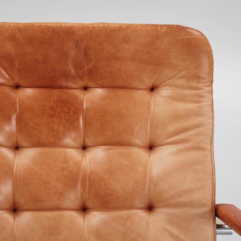 Kenneth Bergenblad, a pair of leather upholstered armchairs from Dux, designed 1978.