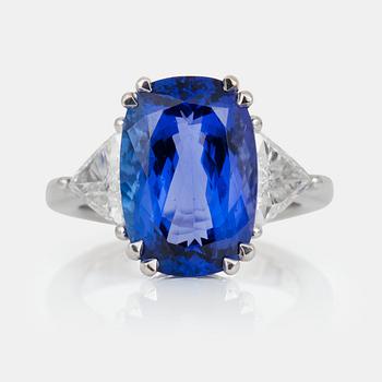 595. A tanzanite, circa 10.15 ct, and trilliant-cut diamond ring. Diamonds circa 1.20 cts in total.