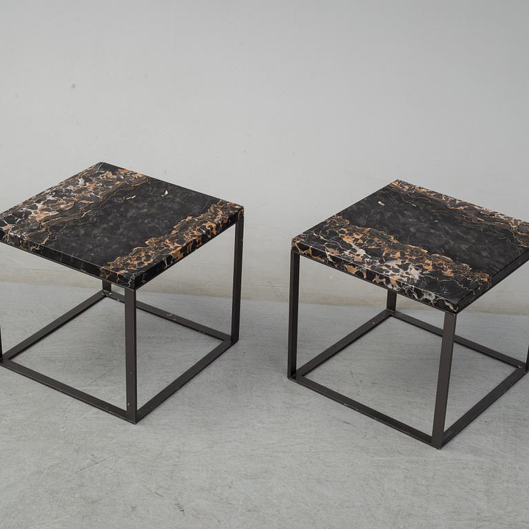 A pair of marble coffee tables from Maxalto, Italy.