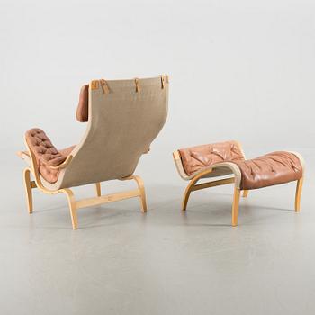 A "PERNILLA" ARMCHAIR WITH OTTAMAN BY BRUNO MATHSSON BY DUX.