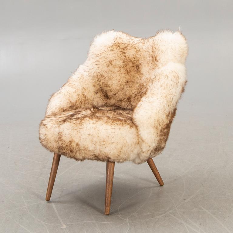 A 1950/60 sheepskin armchair.