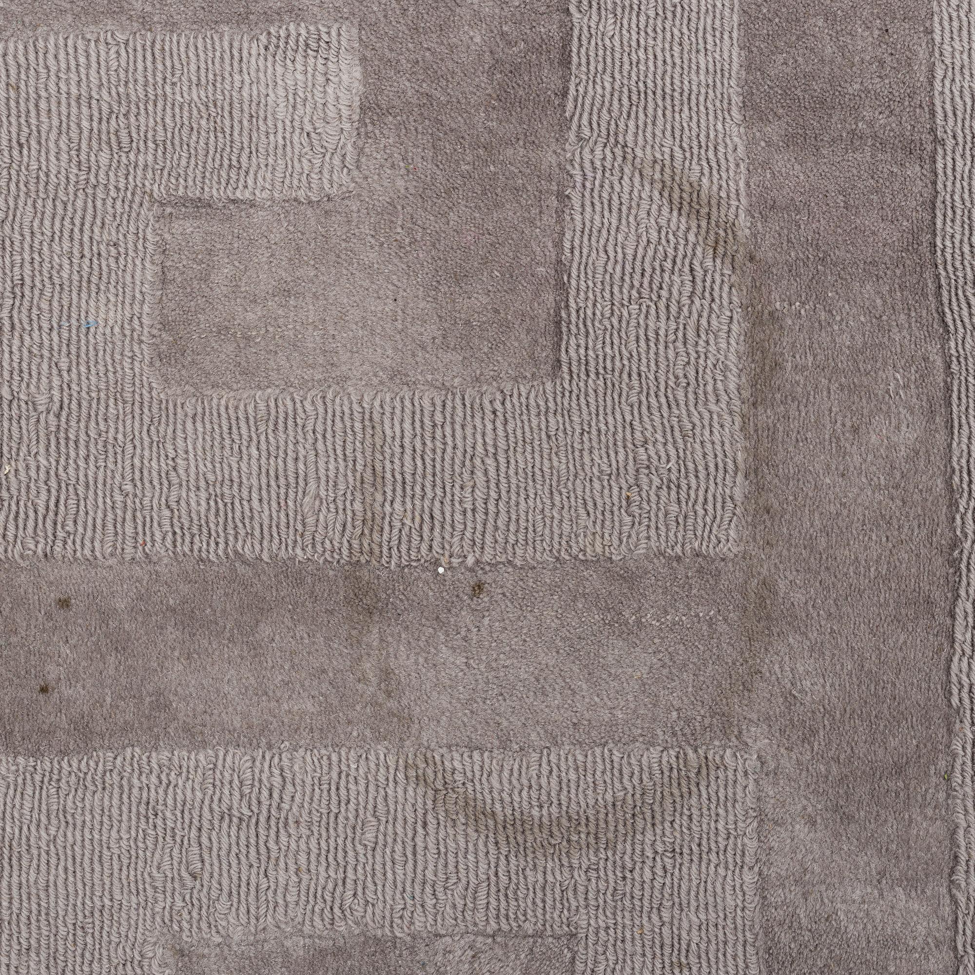 A Layered "Wool Cubes" carpet, 390x620 cm.