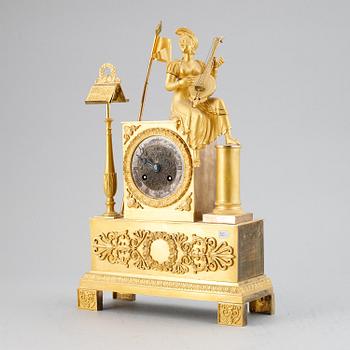 A French Empire gilt bronze mantel clock, early 19th Century.