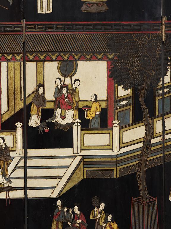 A Chinese four panel lacquer folding screen, first part of the 20th century.