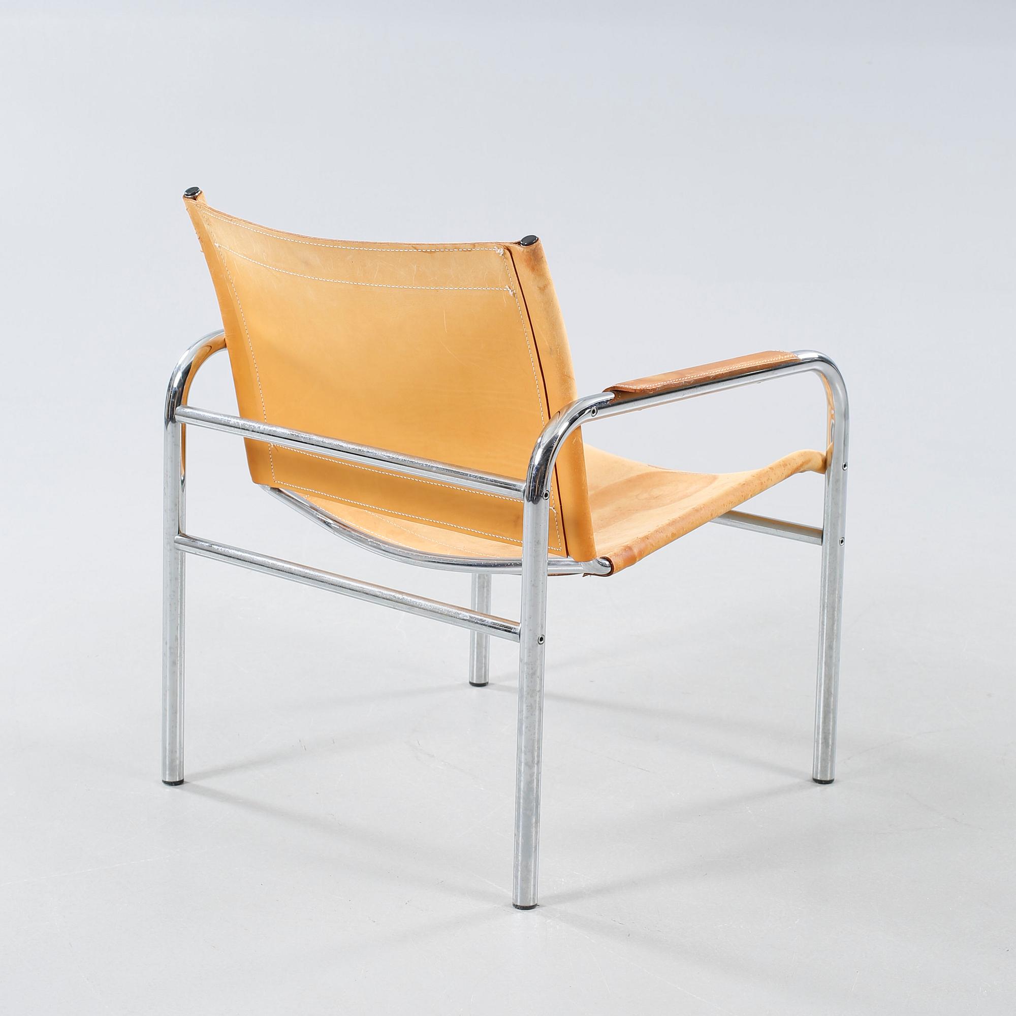 An armchair designed by Tord Björklund, named "Klinte" and made in the fourth quarter of the 20th century.