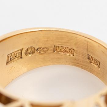 An 18K gold ring set with faceted quartz and old-cut diamons.