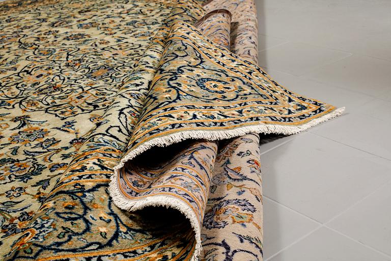 A Keshan rug, signed, ca 370 x 268 cm.