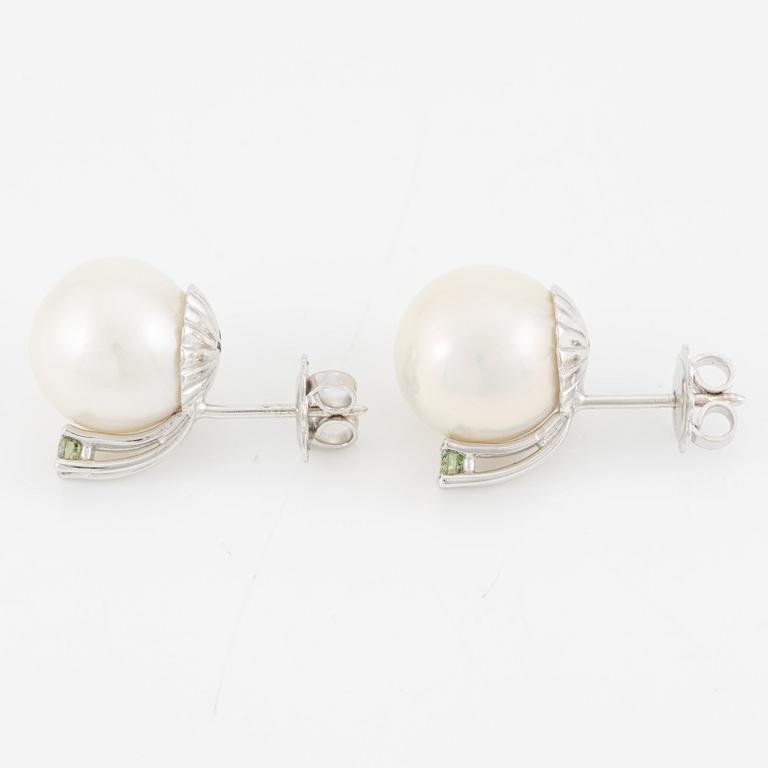 A pair of 18K gold earrings with cultured South Sea pearls.