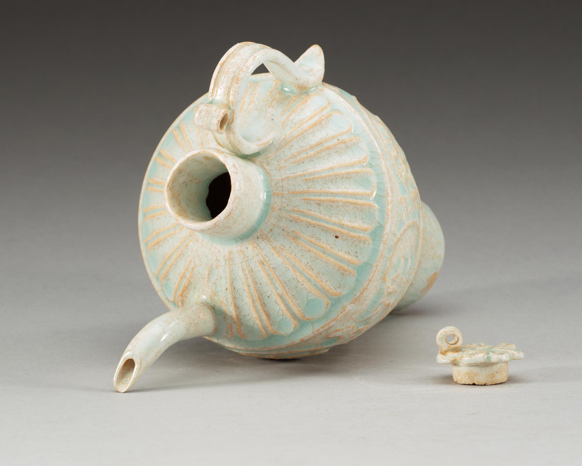 A pale green glazed ewer with cover, Song dynasty (960-1279).