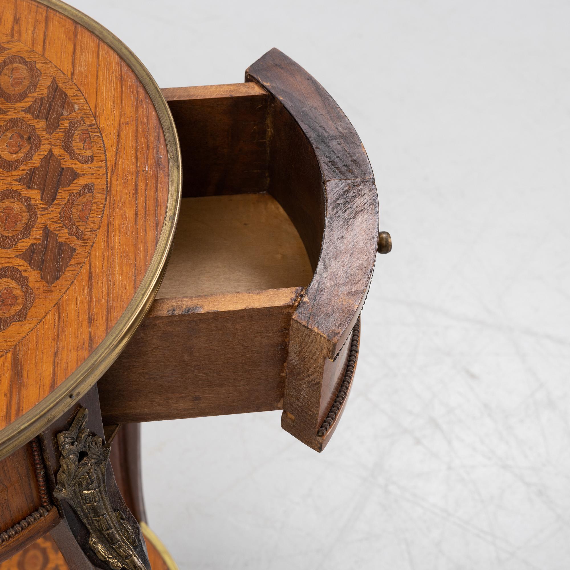 A rococo style table, circa 1900.