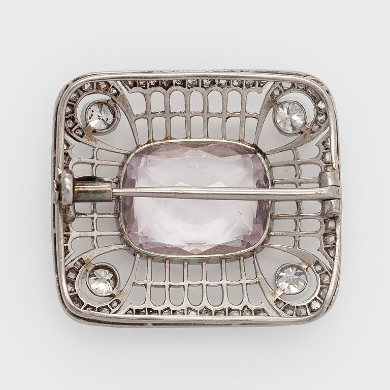 A platinum brooch with morganite and old cut diamonds.