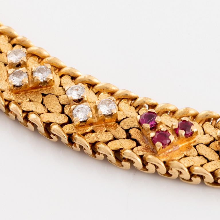 An 18K gold necklace set with round brilliant-cut diamonds and rubies.