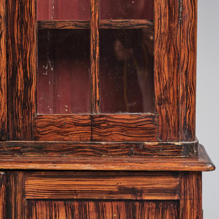 A Swedish faux-boix neo-gothic book cabinet, ca 1830.