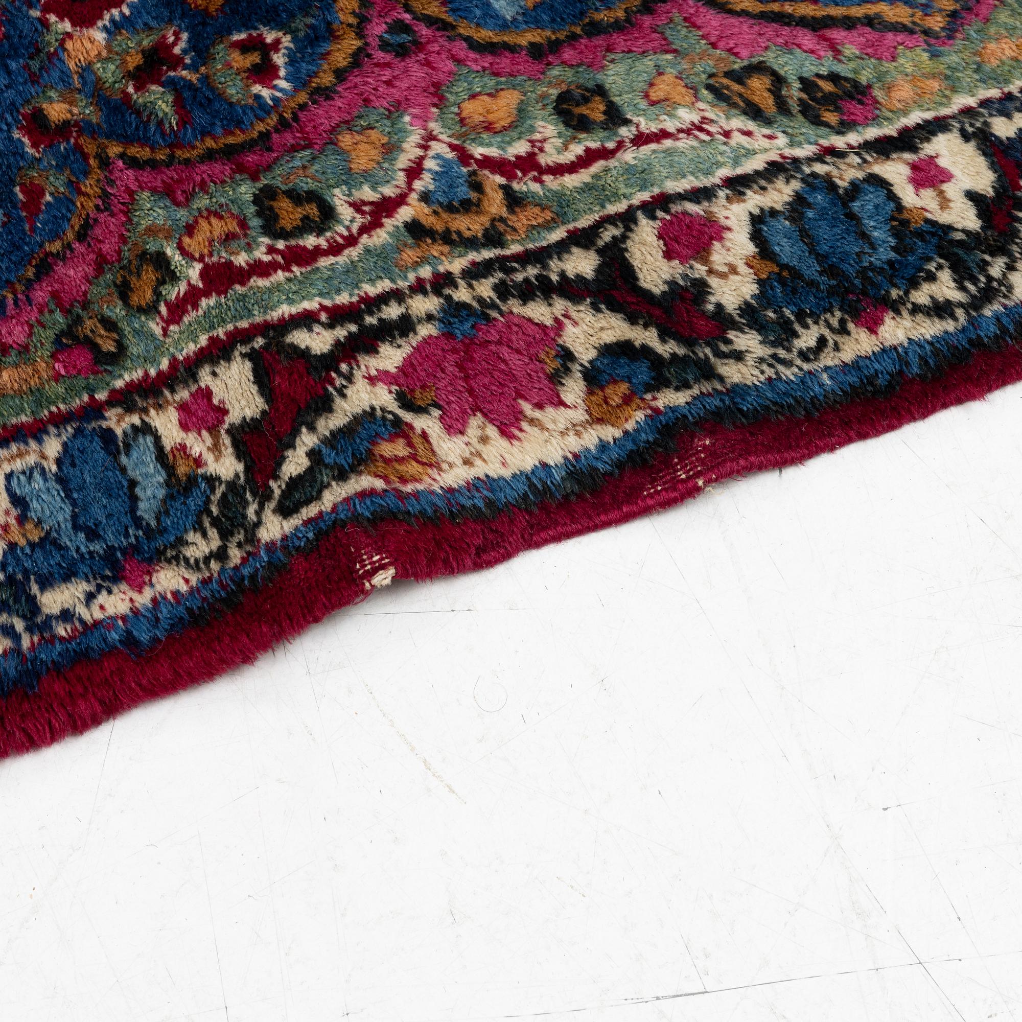 A Kerman carpet, c. 365 x 265 cm.