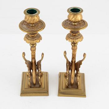 A pair of brass candleholders, 20th century.