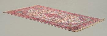 A CARPET, a semi-antique silk Kashan, ca 208,5 x 130 cm.