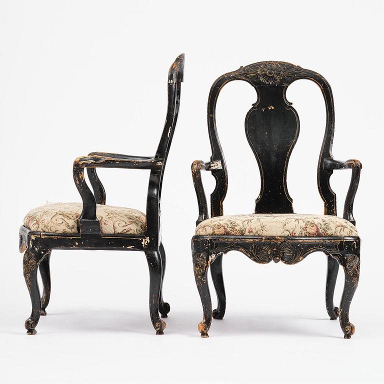 A pair of rococo armchairs in the manner of C. M. Sandberg, later part 18th century.