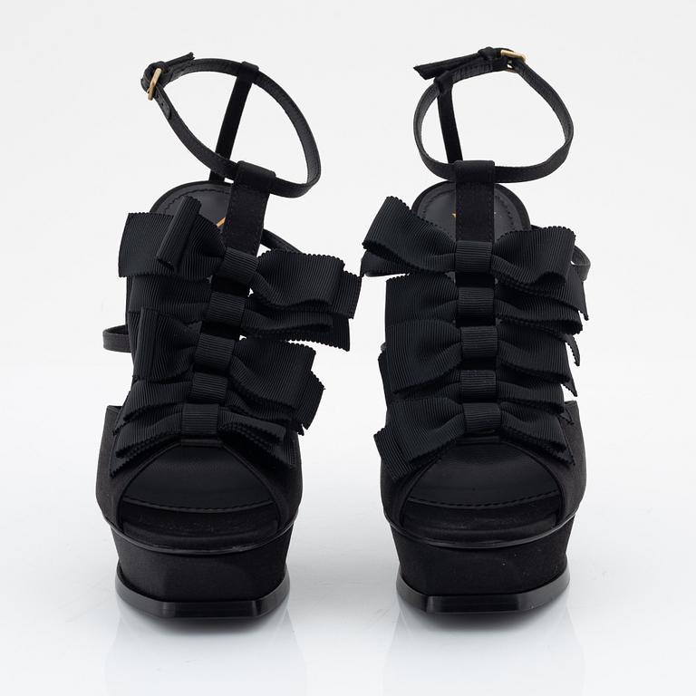 Yves Saint Laurent, a pair of black silk and bows platform sandals, size 37.
