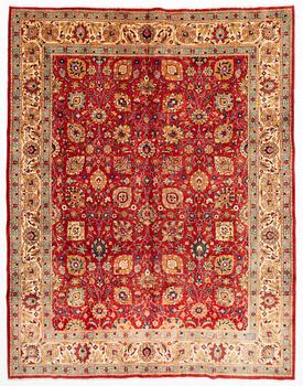 A Tabriz carpet of Shah Abbas design, signed Hadadian, approx. 383 x 290 cm.