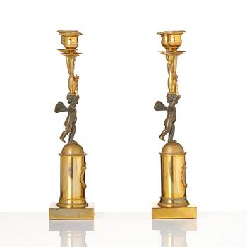 A pair of Empire gilt-brass two-branch candelabra, Stockholm, early 19th century.