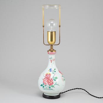 A famille rose bottle vase, Qing dynasty, 18th Century. Mounted as a lamp.