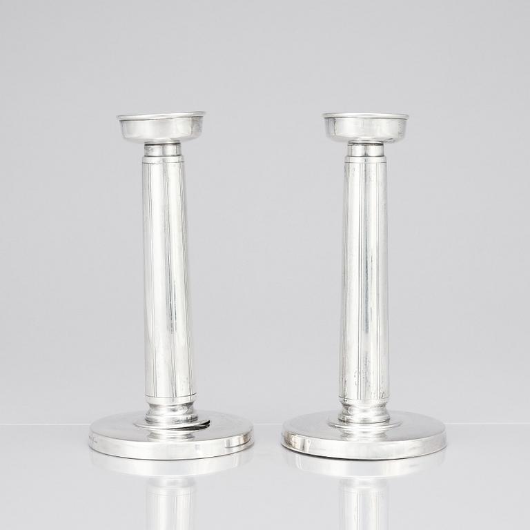 Gustaf Janson, a pair of sterling candlesticks, C.G Hallberg Stockholm 1961.