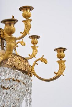 An ormolu and cut glass sixteen-branch Empire chandelier, Paris, early 19th century.