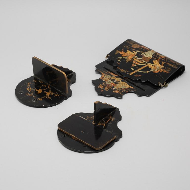 Two Japanese lacquered wall brackets and a letter box, early 20th Century.